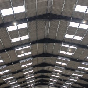 Full Circuit Electrical - Commercial lighting on beams for a warehouse