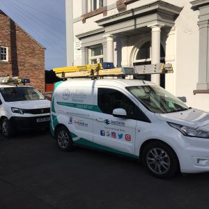 Full Circuit Vans Outside A Rented House